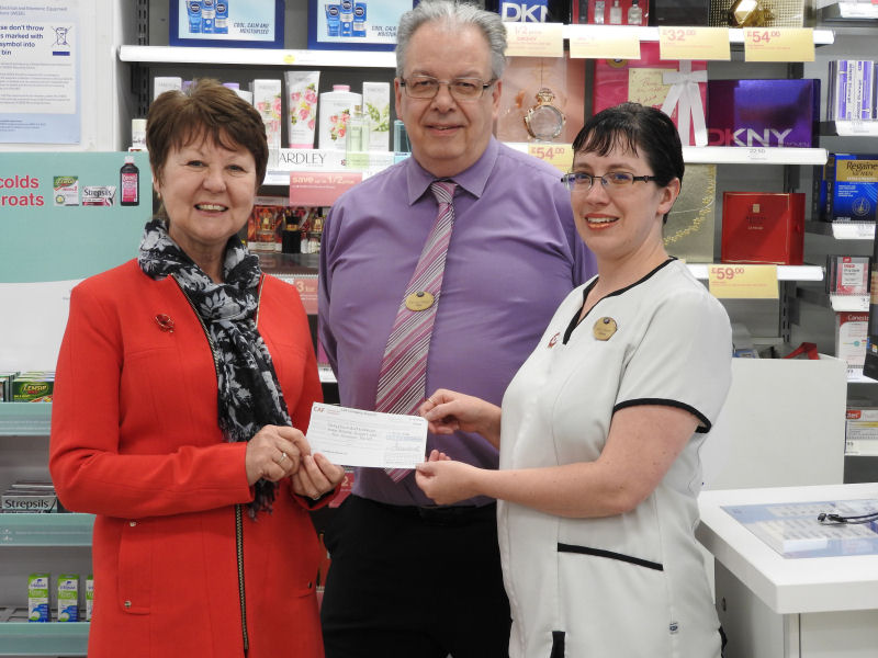 Presentation of cheque received from Katrina from Boots who worked in Fancy Dress
